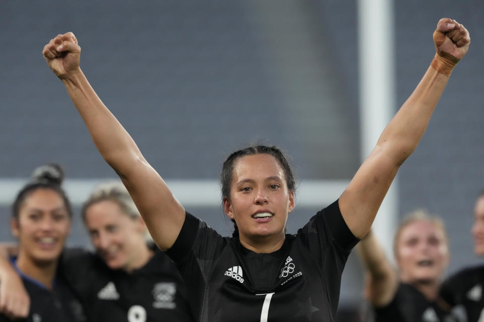 New Zealand's Tyla Nathan-Wong raises her fists as her team celebrates defeating France in the women's rugby gold medal match at the 2020 Summer Olympics, Saturday, July 31, 2021 in Tokyo, Japan. (AP Photo/Shuji Kajiyama)