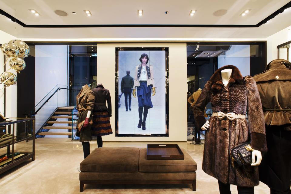 This undated publicity photo provided by BURBERRY shows an interior view of the BURBERRY PRORSUM section of the new BURBERRY Flagship store opened in November 2012 on Michigan Avenue in Chicago. BURBERRY has been known for generations for its signature check pattern and trenchcoat. The company has monthly updates at Burberry.com, where CEO, Angela Ahrendts said, more people visit every week than walk into all the brand's stores around the world combined. (AP Photo/BURBERRY)