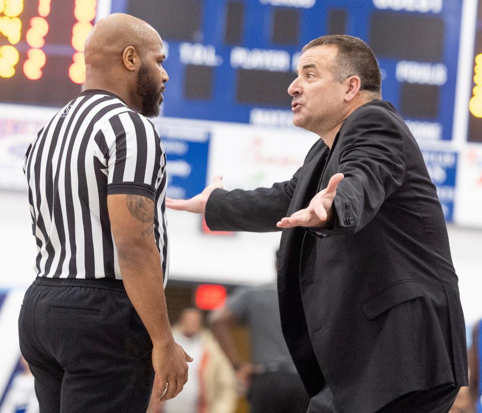 Louisville boys basketball head coach Tom Siegfried talks with a referee during a game against CVCA, Tuesday, Jan. 16, 2024.