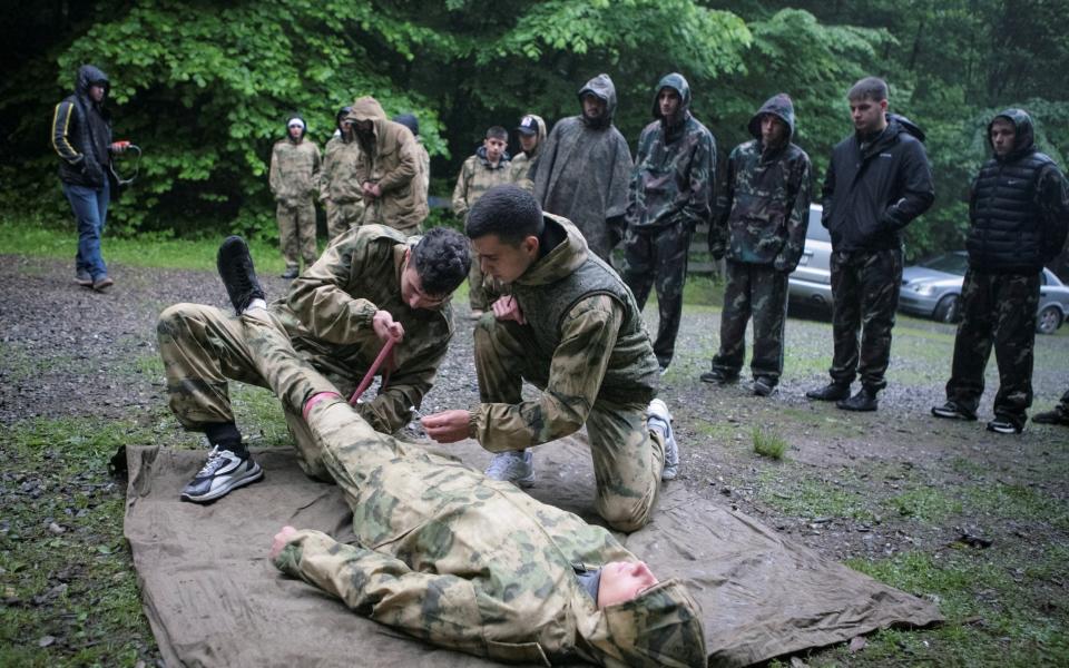 Pupils practise first aid at a range in Vladikavkaz, Russia