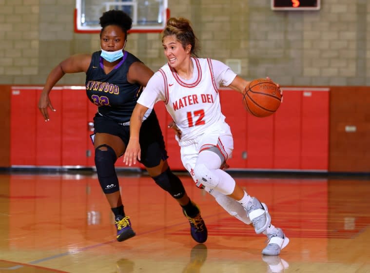 Alyssa Durazo-Frescas of Mater Dei drives against Lynwood.