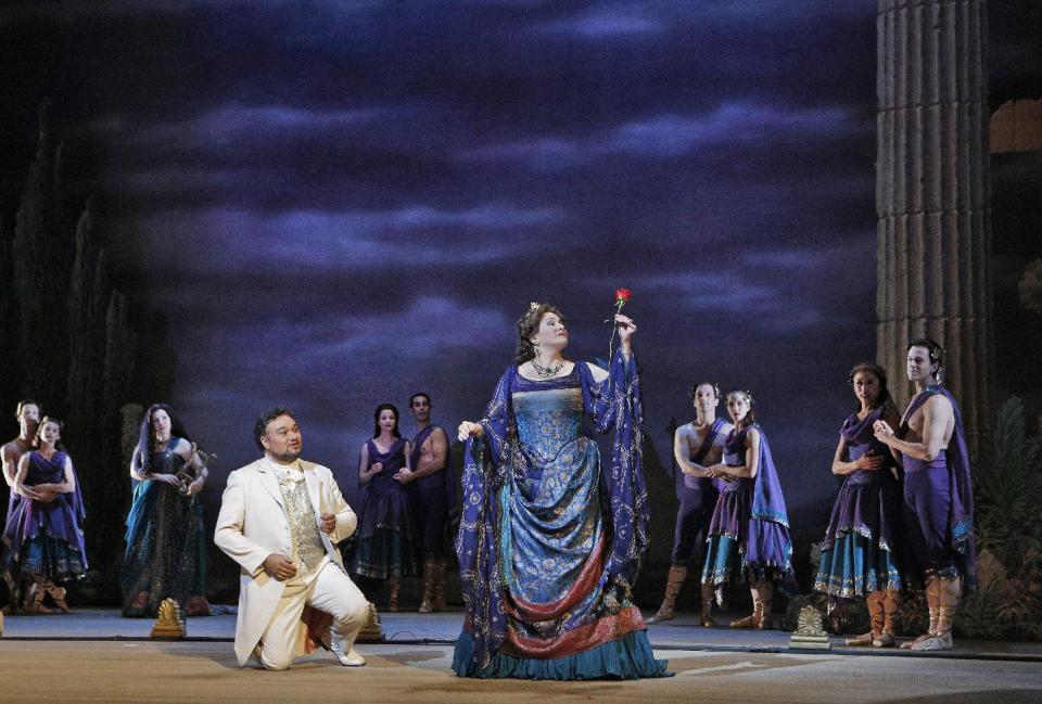 This undated publicity photo provided by the San Francisco Opera shows Ramón Vargas, left, as Faust and Patricia Racette as Elena in Act IV during the dress rehearsal of "Mefistofele," in San Francisco. (AP Photo/Copyright San Francisco Opera, Cory Weaver)