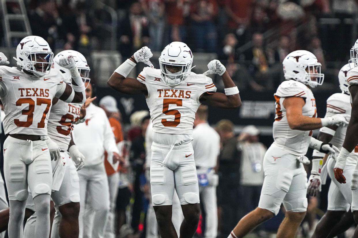 Texas defensive back Malik Muhammad celebrates a defensive stop during the Longhorns' win over Oklahoma State in the Big 12 championship game on Dec. 2. That was the last Big 12 matchup for the Longhorns, who will join the SEC next summer along with fellow Big 12 heavyweight Oklahoma.