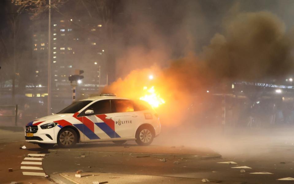 A burning car in the riots at The Hague