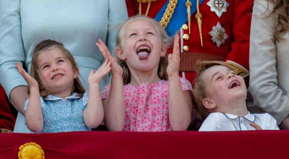 Princess Charlotte and Prince George on the balcony of Buckingham Palace with their cousin, Savannah Phillips