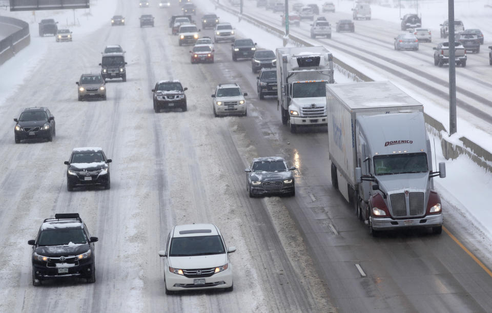 Traffic struggles along the snow-packed southbound lanes of Interstate 25 near the Steele Street overpass as an autumn storm sweeps over the intermountain West Tuesday, Oct. 29, 2019, in Denver. Forecasters predict that this second storm in two days will bring up to a foot of snow in some places in the region as well as pack an intense cold that may drop temperatures to possibly record-setting lows. (AP Photo/David Zalubowski)