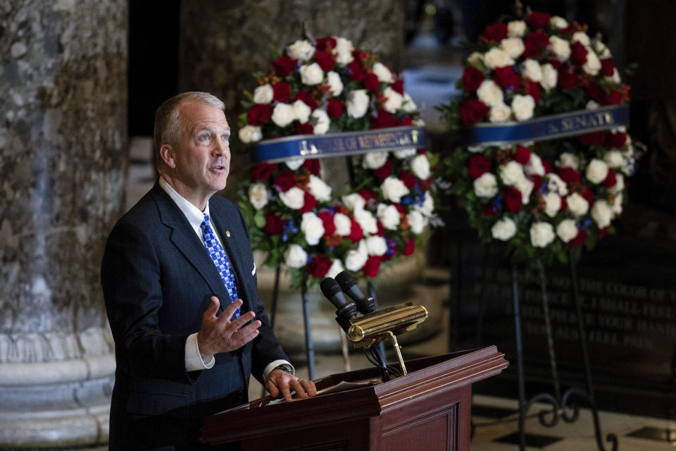 Sen. Dan Sullivan, R-Alaska, speaks during a ceremony for the late Rep. Don Young, R-Alaska, in Statuary Hall as he lies in state on Capitol Hill in Washington, Tuesday, March 29, 2022. Young, the longest-serving member of Alaska's congressional delegation, died Friday, March 18. He was 88. (Bill Clark/Pool Photo via AP)