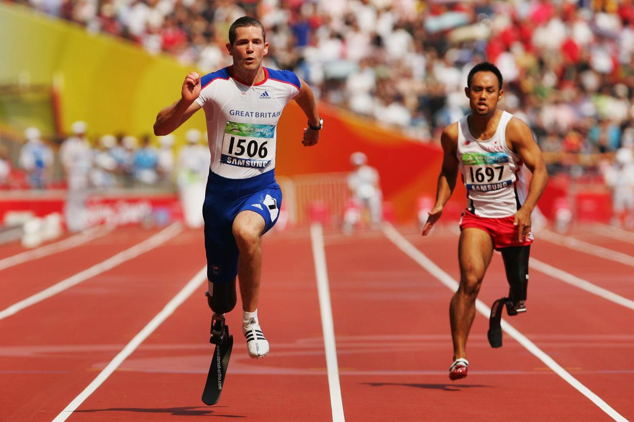 John McFall and Atsushi Yamamoto compete in the final of the Men's 100M -T42 Athletics at the 2008 Paralympics