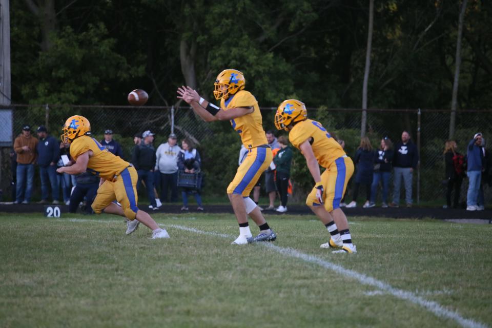 Imlay City quarterback Brady VanderPloeg takes the snap during a game earlier this season. The Spartans will visit Croswell-Lexington on Friday.