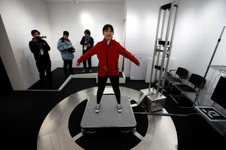 A visitor is scanned to add her images to an animation during the Tokyo 2020 Japan House media preview in Gangneung, South Korea, February 8, 2018. REUTERS/Jorge Silva