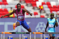 Rai Benjamin, of the United States competes in a men's 400-meters hurdles heat during the World Athletics Championships in Budapest, Hungary, Sunday, Aug. 20, 2023. (AP Photo/Petr David Josek)