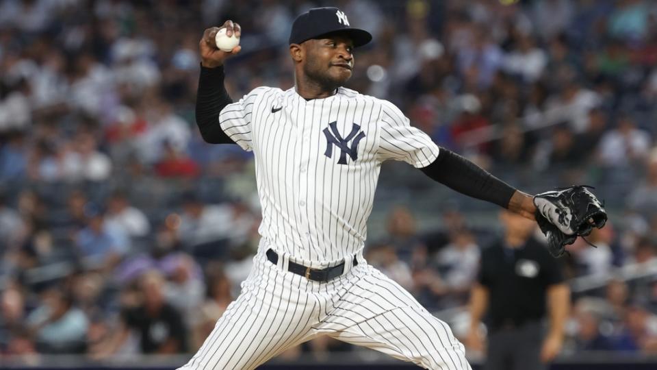 New York Yankees starting pitcher Domingo German (0) delivers a pitch during the seventh inning against the Tampa Bay Rays at Yankee Stadium