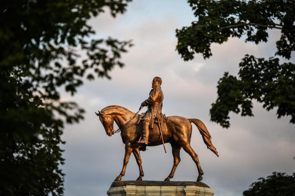 A statue of Confederate general Robert E. Lee is photographed at the center of Lee Circle along Monument Avenue in Richmond, Virginia.