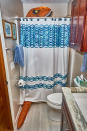 <p>Peeking out of the family abode’s shower. (Photo: Nebraska Realty/Caters News) </p>