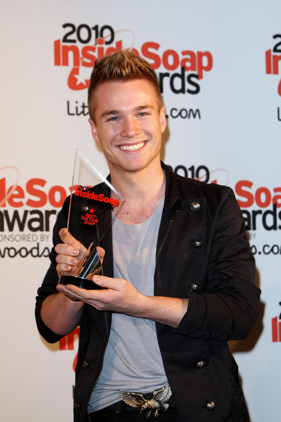 LONDON, ENGLAND - SEPTEMBER 27:  Actor Sam Clark poses with the Best Daytime Soap Award for Neighbours at the Inside Soap Awards 2010 at Shaka Zulu on September 27, 2010 in London, England.  (Photo by Claire Greenway/Getty Images)