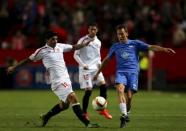 Football Soccer - Sevilla v Molde FK- UEFA Europa League Round of 32 First Leg - Ramon Sanchez Pizjuan stadium, Seville - 18/2/16 Sevilla's Ever Banega (L) and Molde's Mattias Mostrom in action. REUTERS/Marcelo del Pozo