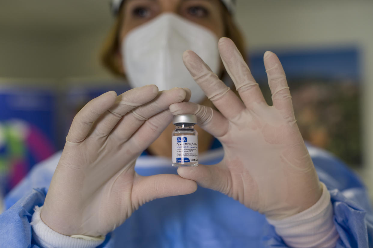 SAN MARINO, ITALY - FEBRUARY 25: A worker with a vial of Sputnik vaccine during the Covid-19 vaccination campaign on February 25, 2021 in San Marino, Italy. The vaccination campaign for Covid-19 with Russian Sputnik vaccine for 25 healthcare workers started today. (Photo by Michele Lapini/Getty Images)