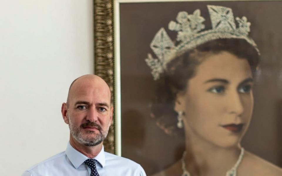 Scott Furssedonn-Wood with a portrait of The Queen - Heathcliff O'Malley for The Telegraph