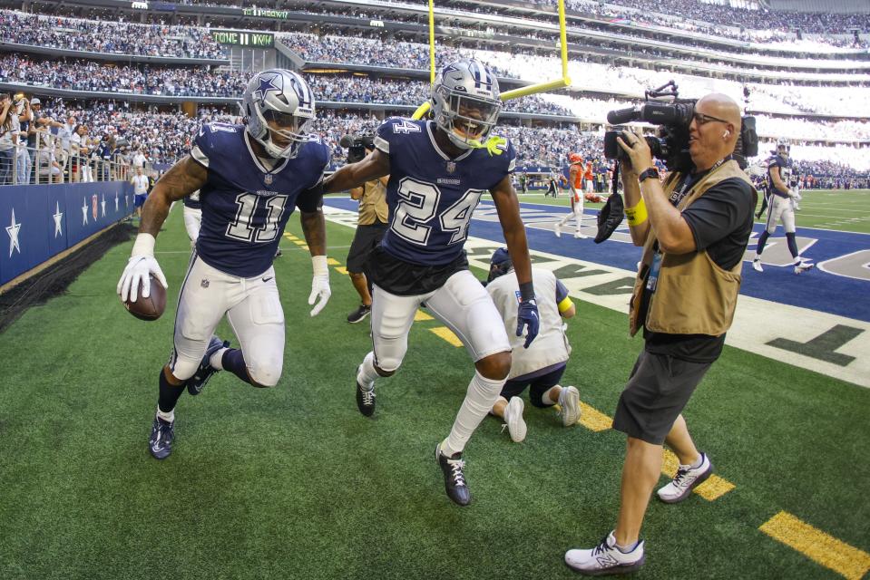 Dallas Cowboys' Micah Parsons celebrates his fumble recovery and touchdown run during the second half of an NFL football game against the Chicago Bears Sunday, Oct. 30, 2022, in Arlington, Texas. (AP Photo/Ron Jenkins)