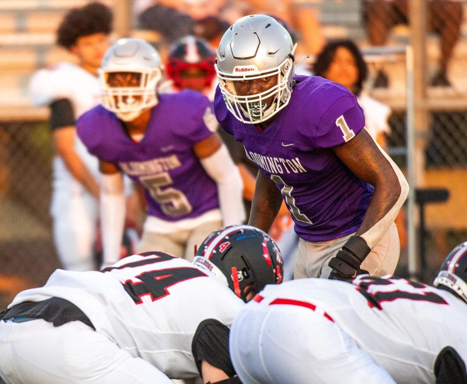 Bloomington High School South's Dasan McCullough (1) and Daeh McCullough (5) line up for a play during a football game against New Albany Aug. 20 at South. The host Panthers won the season opener, 50-20.