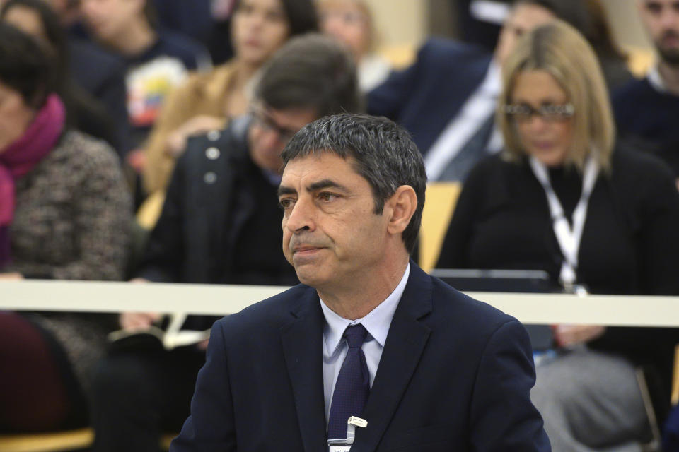 Former Catalan regional police chief Josep Lluis Trapero sits in the dock of the National court on the outskirts of Madrid, Spain, Monday Jan. 20, 2020. A trial starts Monday against former Catalan regional police chief Josep Lluis Trapero and other officials for their role in the 2017 independence attempt. (Fernando Villar, Pool photo via AP)