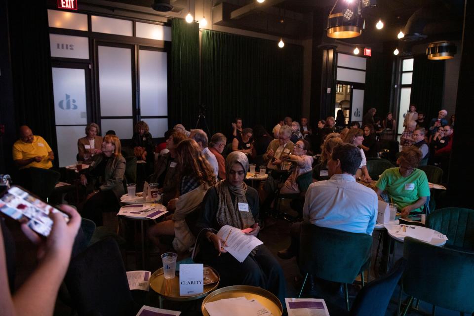 People are put into groups and converse during Millions of Conversations’ event Conversation of Grief, Healing and Hope, at AnzieBlue in Nashville, Tenn., Thursday, Oct. 26, 2023.