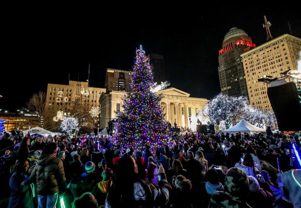 The holiday tree is lighted in Jefferson Square Park during Light Up Louisville.