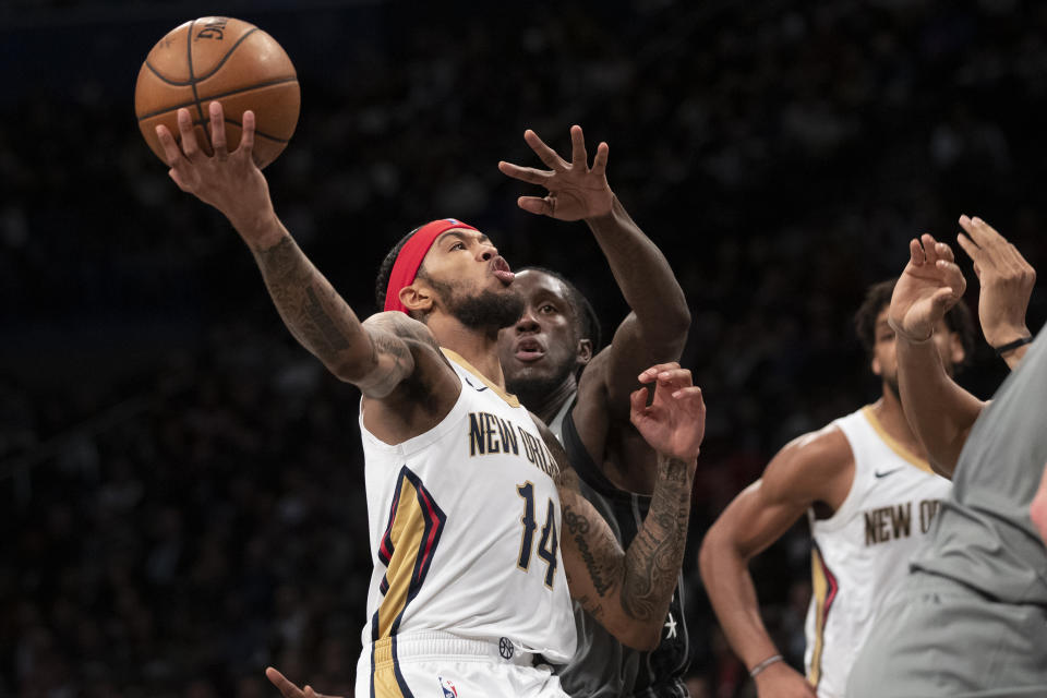 New Orleans Pelicans forward Brandon Ingram (14) goes to the basket against Brooklyn Nets forward Taurean Prince during the first half of an NBA basketball game, Monday, Nov. 4, 2019, in New York. (AP Photo/Mary Altaffer)