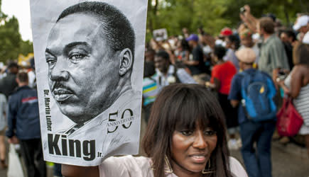 WASHINGTON, DC - AUGUST 24: People arrive at the National Mall to celebrate the 50th anniversary of the March on Washington and Dr. Martin Luther King, Jr.'s 'I have a Dream' speech on the National Mall on August 24, 2013 in Washington, DC. A commemorative march and a rally along the historic route followed in 1963 is led by civil rights leaders Al Sharpton and Martin Luther King III. (Photo by Pete Marovich/Getty Images)