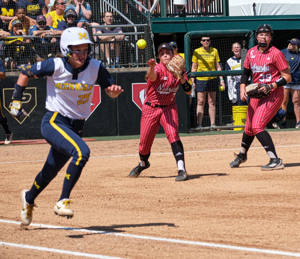 Nebraska's Sidney Gray (7) fields the ball on the infield and throws out Michigan's Audrey LeClair (25) in Big Ten Championship action at Secchia Stadium on the Michigan State campus Saturday, May 14, 2022.