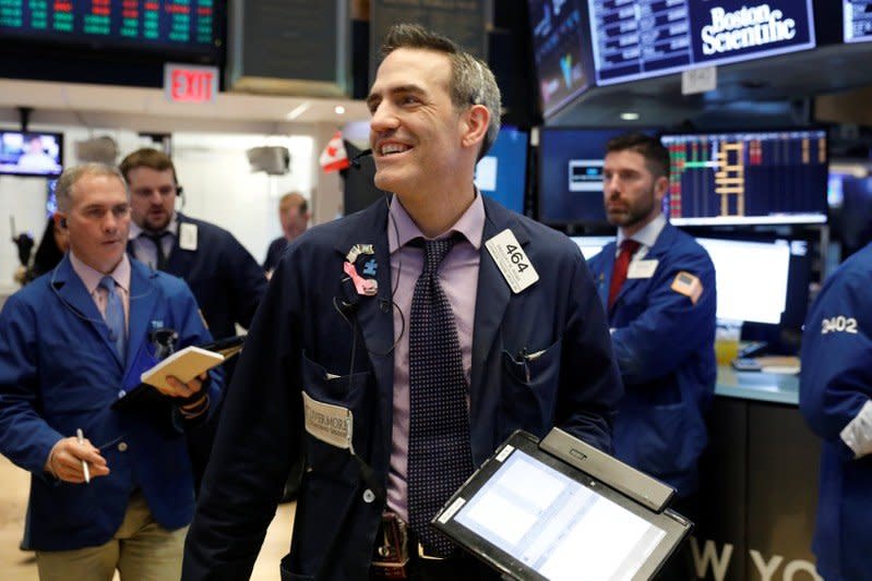 Traders work on the floor of the New York Stock Exchange shortly after the opening bell in New York, U.S., January 12, 2018.  REUTERS/Lucas Jackson