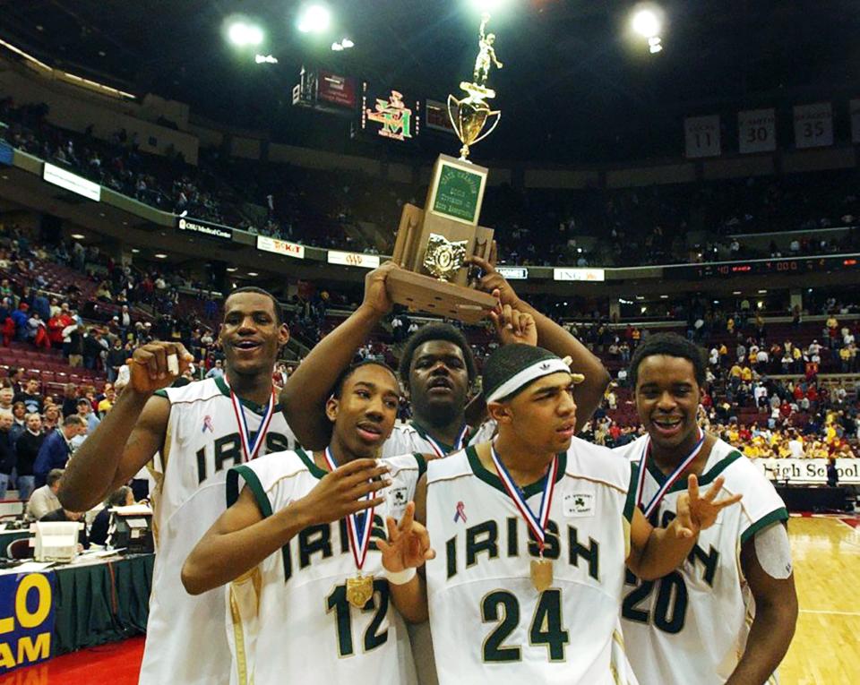 LeBron James, Dru Joyce III, Sian Cotton, Romeo Travis and Willie McGee celebrate St. Vincent-St. Mary's state championship in 2003.