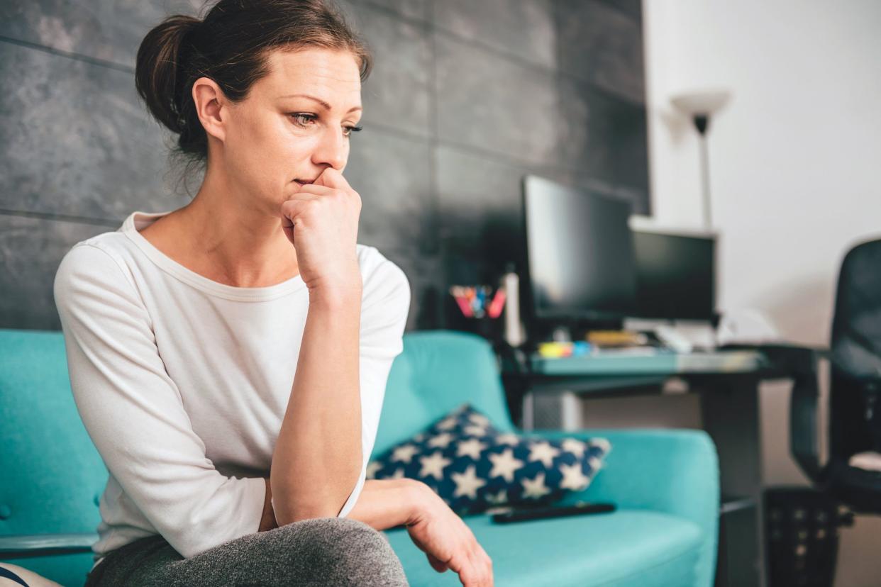 anxious- and sad-looking woman