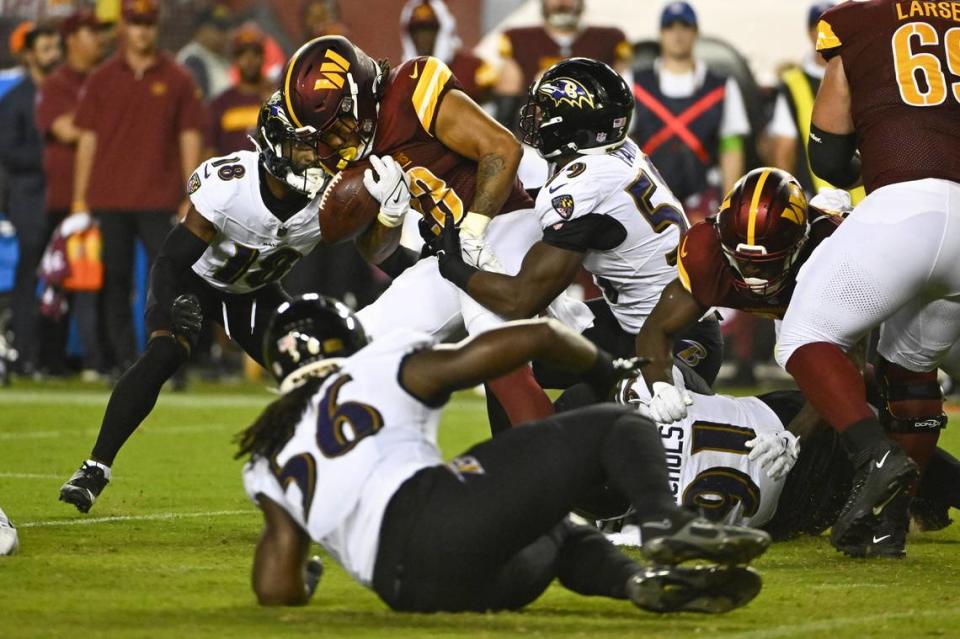 Commanders running back Chris Rodriguez fumbles the ball against the Ravens during the second half Monday night.