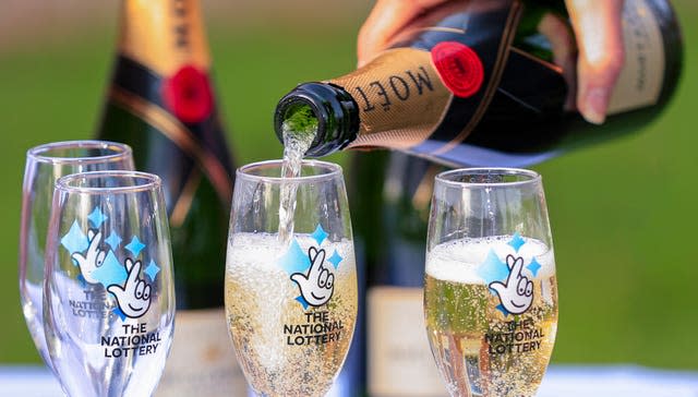 A bottle of Moet & Chandon champagne with The National Lottery branded champagne flutes (Peter Byrne/PA)