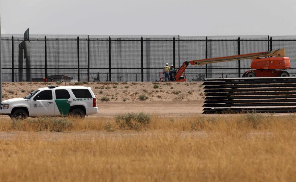 A Border Patrol unit drives by the construction site of a new section of the border wall between El Paso, Texas, and Ciudad Juarez, Chihuahua state, Mexico on August 17, 2020.