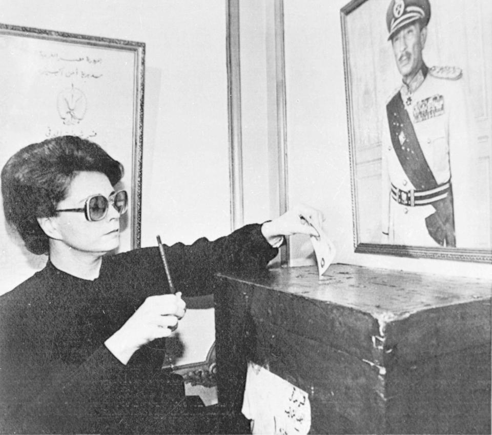 FILE - In this Oct. 18, 1981, file photo, Jehan Sadat, widow of slain Egyptian President Anwar Sadat votes near her home in Giza at a local police station in a referendum to endorse Hosni Mubarak as her husband's successor. Jehan Sadat died in Cairo on Friday, July 9, 2021, at the age of 87, Egypt’s President’s office said. (AP Photo/Bill Foley, File)