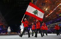 Lebanon's flag-bearer Alexandre Mohbat leads his country's delegation during the opening ceremony of the 2014 Sochi Winter Olympic Games at Fisht stadium February 7, 2014. REUTERS/Brian Snyder (RUSSIA - Tags: OLYMPICS SPORT)