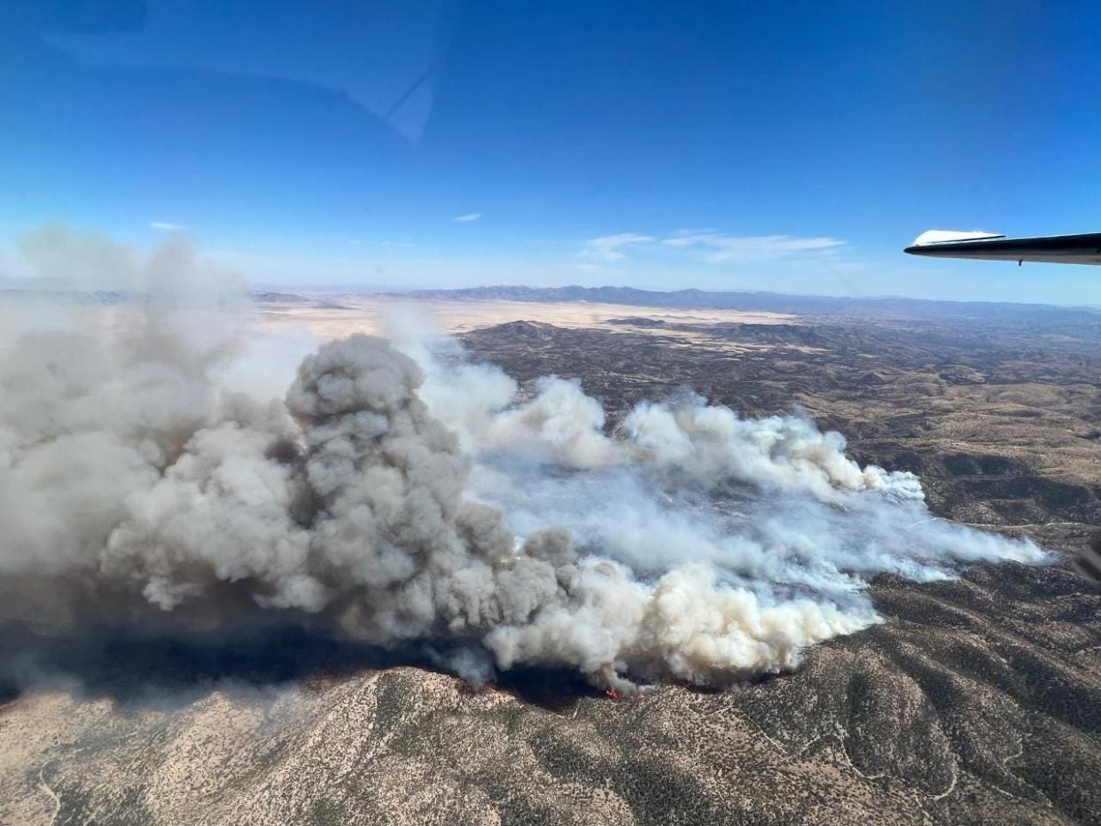 An aerial view of the Foster Fire May 30, 2022 burning in New Mexico's bootheel in the Coronado National Forest near the border of Arizona.