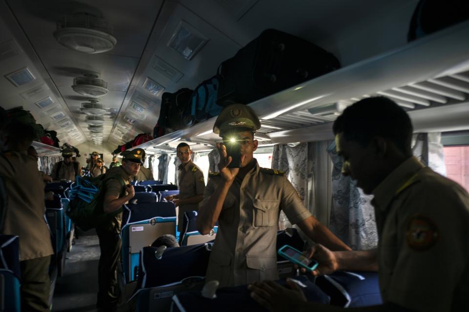 Cadets board the first train using new equipment from China, in Havana, Cuba, Saturday, July 13, 2019. The first train using new equipment from China pulled out of Havana Saturday, hauling passengers on the start of a 915-kilometer (516-mile) journey to the eastern end of the island as the government tries to overhaul the country’s aging and decrepit rail system. (AP Photo/Ramon Espinosa)