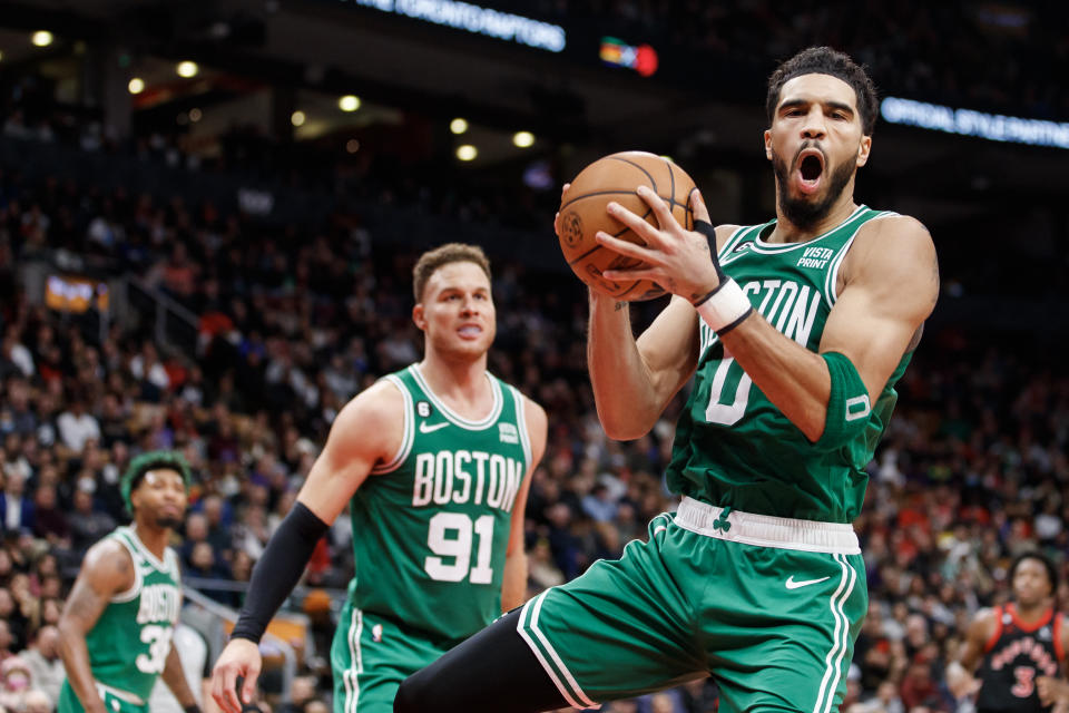 TORONTO, ON - DECEMBER 05: Jayson Tatum #0 of the Boston Celtics grabs a rebound against the Toronto Raptors during the second half of their NBA game at Scotiabank Arena on December 5, 2022 in Toronto, Canada. NOTE TO USER: User expressly acknowledges and agrees that, by downloading and or using this photograph, User is consenting to the terms and conditions of the Getty Images License Agreement. (Photo by Cole Burston/Getty Images)