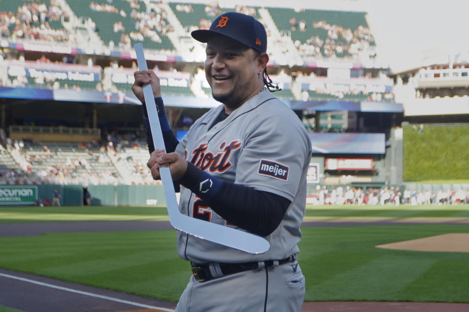 Detroit Tigers' Miguel Cabrera holds a silver hockey stick presented by the Minnesota Twins to honor his career before a baseball game Tuesday, Aug. 15, 2023, in Minneapolis. Cabrera has announced his retirement at the end of the season. (AP Photo/Bruce Kluckhohn)