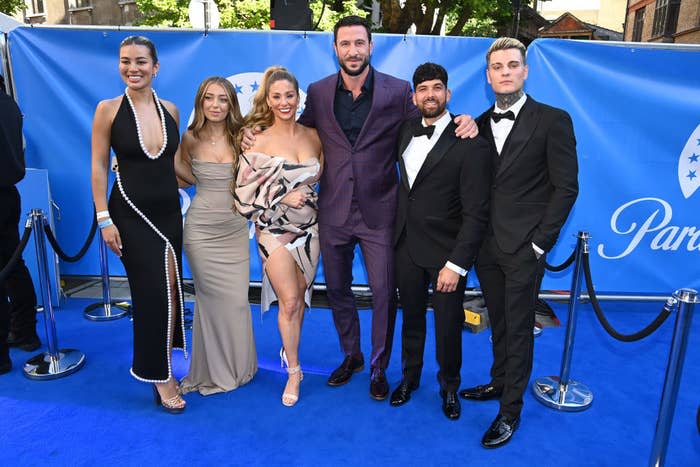 A group of people on the red carpet