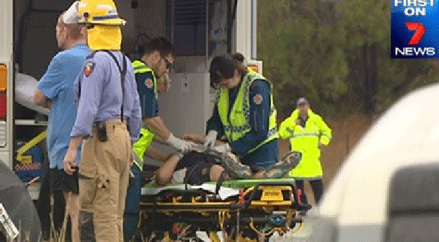 A student on a stretcher being taken to Gladstone hospital. Source: 7News