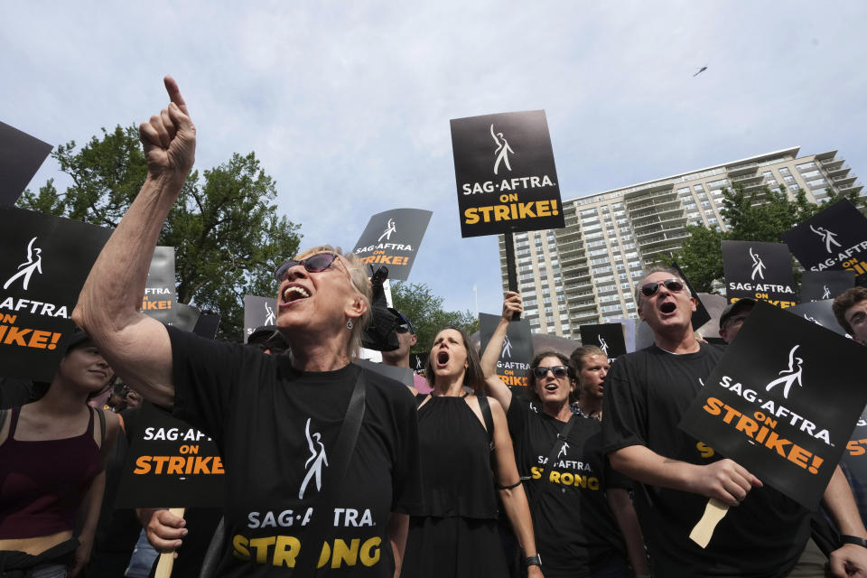 Striking film and television actors and supporters display signs and chant slogans while marching, Wednesday, July 19, 2023, in Boston. (AP Photo/Steven Senne)