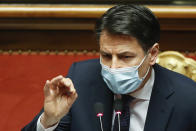 Italian Prime Minister Giuseppe Conte speaks during his final address at the Senate prior to a confidence vote, in Rome, Tuesday, Jan. 19, 2021. Italian Premier Giuseppe Conte fights for his political life with an address aimed at shoring up support for his government, which has come under fire from former Premier Matteo Renzi's tiny but key Italia Viva (Italy Alive) party over plans to relaunch the pandemic-ravaged economy. (Yara Nardi/pool photo via AP)