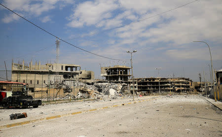 Destroyed buildings from clashes are seen during a battle with Islamic State militants at Dawasa neighborhood in Mosul, Iraq, March 8, 2017. REUTERS/Thaier Al-Sudani