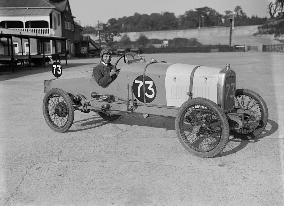 <p>A driver sits at the ready as he poses for a photograph at the Enfield-Allday 200-mile race in Surrey, England, United Kingdom.</p>