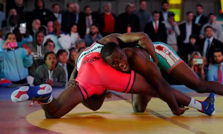 Jordan Burroughs (USA), left, competes with Luis Esteban Quintana Martinez (Cuba) in the men’s freestyle 74 kg/163 lbs at Times Square. Mandatory Credit: Robert Deutsch-USA TODAY Sports