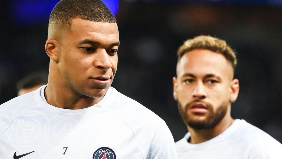 Kylian Mbappe (pictured left) looking on during warm-up with Neymar (pictured right).